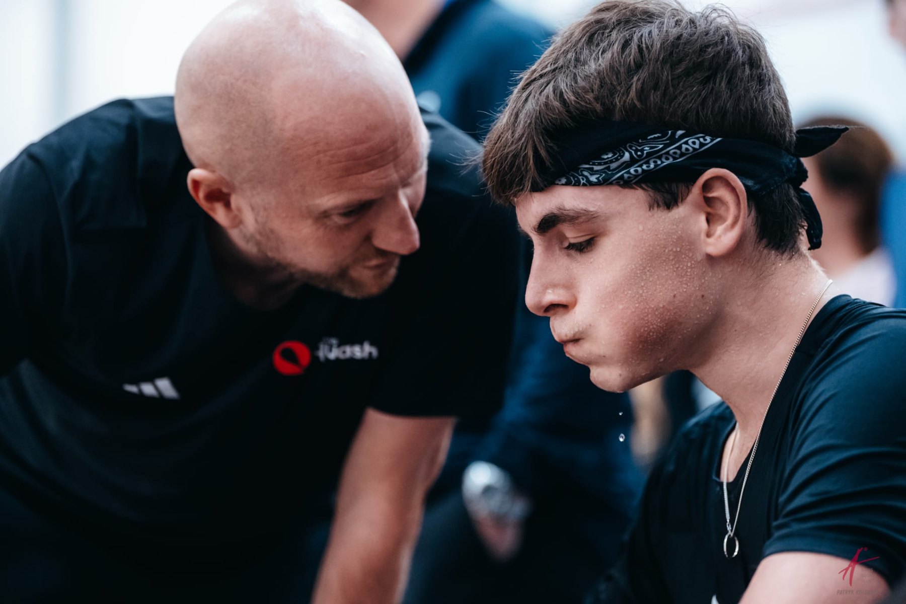 Tim Vail coaching an England junior between games