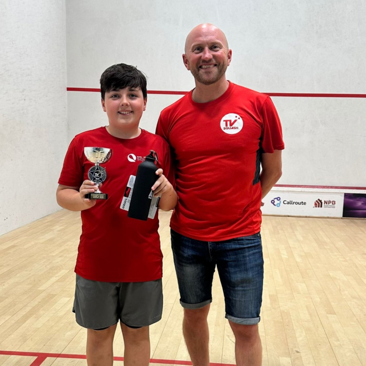 Tim Vail presenting a trophy